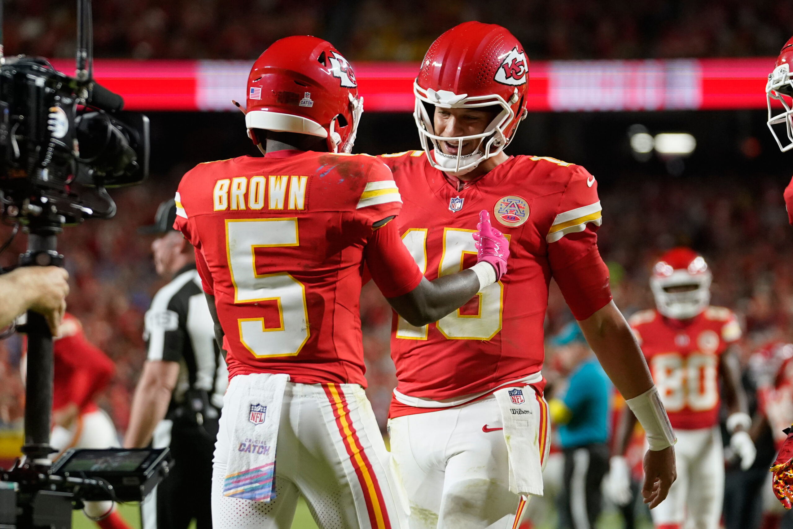 Kansas City Chiefs wide receiver Hollywood Brown is congratulated by quarterback Patrick Mahomes after scoring during the second half of an NFL football game against the Detroit Lions on Oct. 12, 2025, in Kansas City, Missouri.