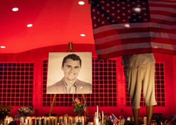 People pay their respects during a candlelight vigil for Charlie Kirk at a makeshift memorial at Orem City Center Park in Orem, Utah, on Sept. 11.