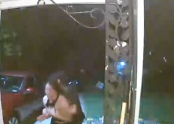 A woman appears to be abducted in Wichita, Kansas, as shown in footage posted by the Wichita Police Department on Oct. 13, 2025.