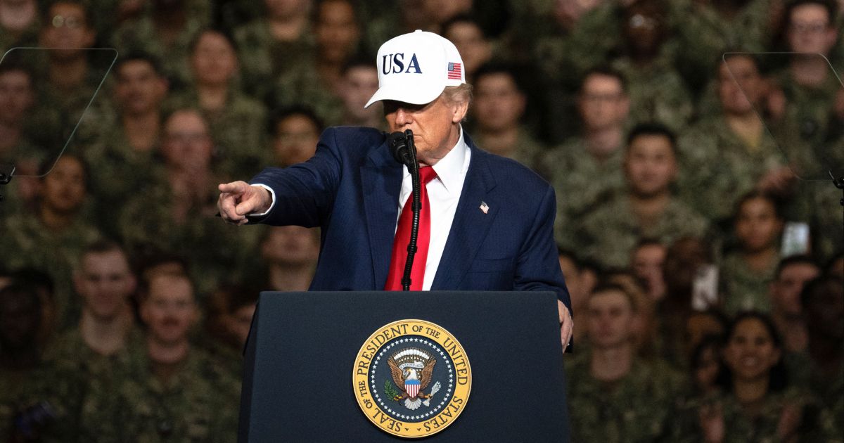 President Donald Trump delivers a speech to U.S. Navy personnel on board the USS George Washington aircraft carrier at the US naval base in Yokosuka, Japan, on Tuesday.