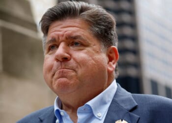 Illinois Gov. JB Pritzker waits to speak at a news conference in Chicago, Illinois, on Aug. 25.