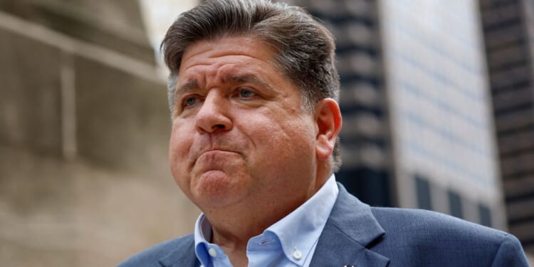 Illinois Gov. JB Pritzker waits to speak at a news conference in Chicago, Illinois, on Aug. 25.