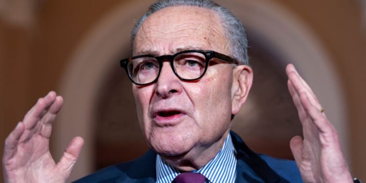 Senate Minority Leader Chuck Schumer speaks to reporters outside the Senate chambers at the Capitol in Washington, D.C., on Thursday.