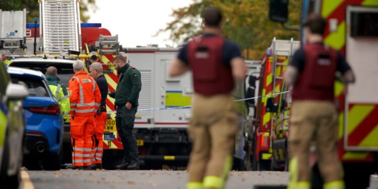 Emergency service workers respond to a stabbing incident at Heaton Park Hebrew Congregation synagogue in Manchester, England, on Thursday.