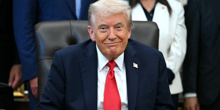 President Donald Trump smiles during an announcement in the Oval Office of the White House in Washington, D.C., on Oct. 16, 2025.