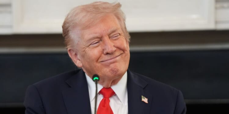President Donald Trump smiles during a meeting Wednesday at the White House in Washington, D.C.