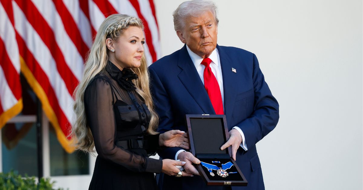 President Donald Trump, right, posthumously awards the Presidential Medal of Freedom to late conservative activist Charlie Kirk as he presents the Medal to his wife Erika Kirk, left, in the Rose Garden of the White House in Washington, D.C., on Tuesday.