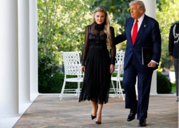 President Donald Trump escorts Erika Kirk, wife of late conservative activist Charlie Kirk, to a ceremony Tuesday in which he posthumously awarded the Presidential Medal of Freedom to Charlie Kirk during a ceremony in the Rose Garden of the White House.