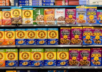 Boxes of cereal from several brands, including Honey Bunches and Kelloggs, on the shelves of a Walmart store in Florida City, Florida, on Aug. 5, 2025.