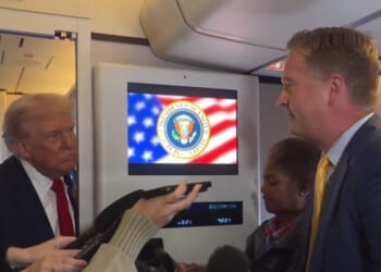After being asked a question by Fox News' Peter Doocy, right, aboard Air Force One, President Donald Trump, left, discussed his salvation and stated that he was unsure he would be able to get into Heaven.