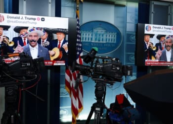 Screens display AI-modified videos of House Minority Leader Hakeem Jeffries and Senate Minority Leader Chuck Schumer that were shared on social media by President Donald Trump in the Brady Press Briefing Room at the White House in Washington, D.C., on Wednesday.