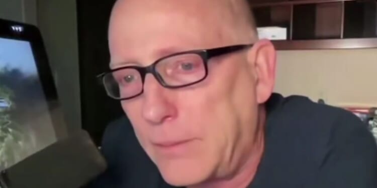 On Monday, Scott Adams teared up while addressing MAGA voters, saying they took a chance with their personal lives by supporting President Donald Trump, but it was worth it after Trump secured a ceasefire in the Middle East.