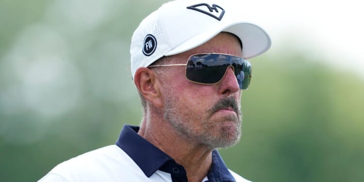 Phil Mickelson stands on the 14th hole on day one of LIV Golf Chicago in Bolingbrook, Illinois, on Aug. 8.