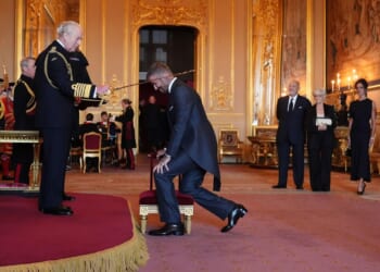 Bend a knee like David Beckham: Soccer star is knighted by King Charles III