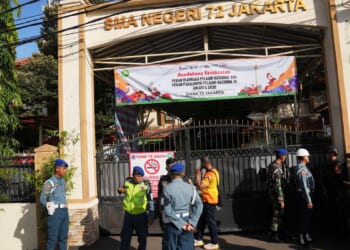 Several explosions shake a mosque in an Indonesian high school and injure 55