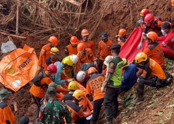 Indonesian rescuers search for nearly three dozen people after landslides killed at least 18 people
