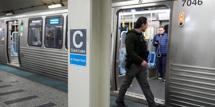 Police say man sets fire to a woman on a Chicago L train before fleeing