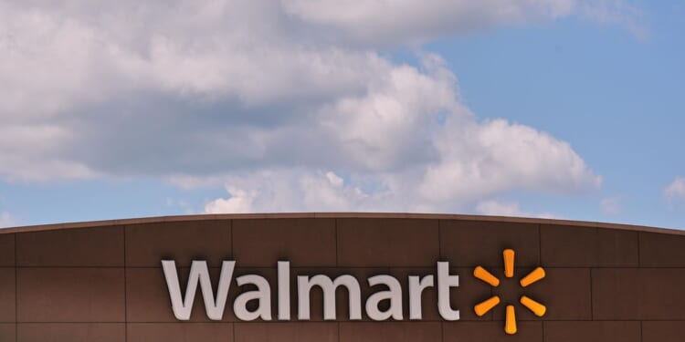 As Americans hunt for deals in slower economy, Walmart raises profit expectations