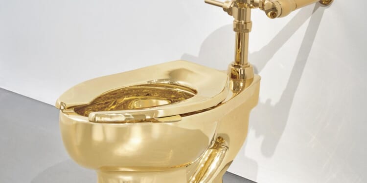 Italian artist's 18-karat gold toilet titled 'America' sells for over $12 million at auction
