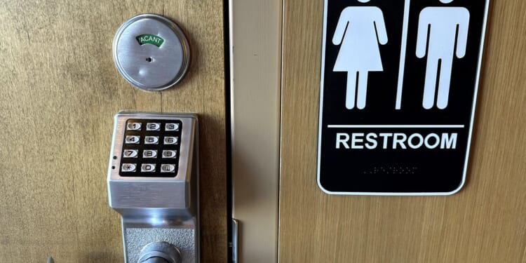 Transgender federal employee sues to topple Trump's ban on biological men in women's restrooms