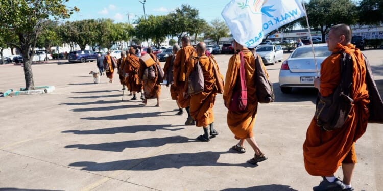Buddhist monks resume 2,300-mile walk for peace after accident near Houston