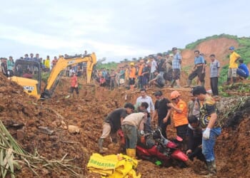 The search for survivors in Indonesia as the death toll from floods and landslides tops 300