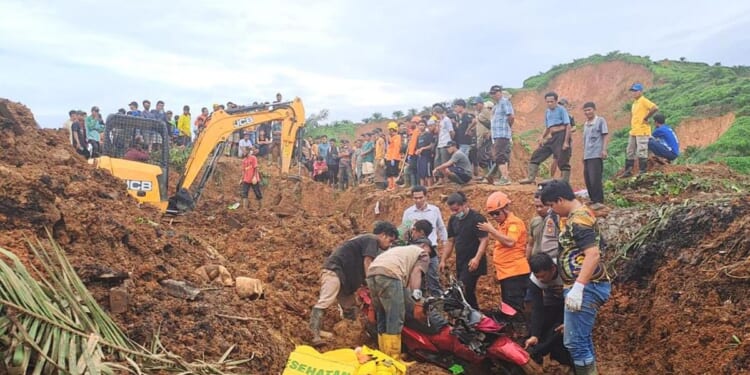 The search for survivors in Indonesia as the death toll from floods and landslides tops 300