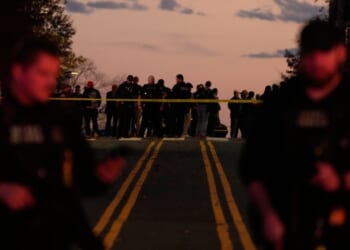 Emergency personnel stand near the White House where two National Guard soldiers were shot in Washington, DC on Nov. 26, 2025.