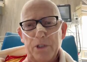 Scott Adams posted live streams to X and YouTube on Wednesday explaining he was confined to a hospital chair and therefore would not be recording an episode.