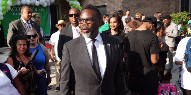 Chicago Mayor Brandon Johnson greets students, parents, and staff during the first day of classes at Beidler Elementary School on Aug. 21, 2023, in Chicago, Illinois.