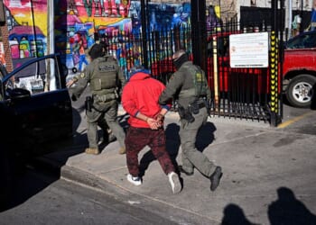 U.S. Border Patrol officers arrest an individual Nov. 6 in the Little Village neighborhood of Chicago, Illinois. (Joshua Lott - The Washington Post / Getty Images)