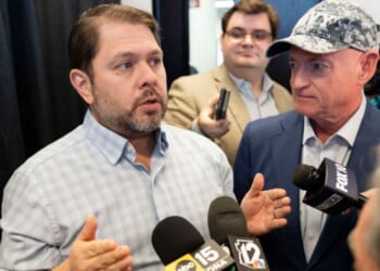 Sen. Ruben Gallego, left, an Arizona Democrat, appeared to threaten "consequences" for military service members who take part in a potential court-martial of his colleague, Democratic Sen. Mark Kelly of Arizona, right. The two are seen discussing Medicaid budget cuts at a March news conference in Scottsdale, Arizona.