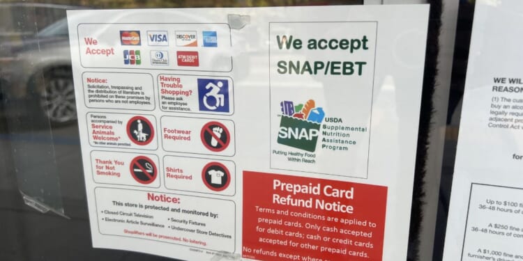 A sign advertising "We Accept SNAP and EBT" posted outside a store in Lafayette, California, on Nov. 4, 2025.