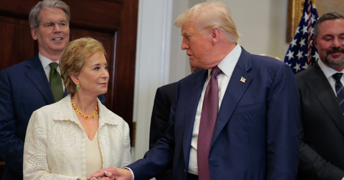 President Donald Trump speaks with Secretary of Education Linda McMahon during an executive order signing ceremony in the Roosevelt Room of the White House on July 31, 2025, in Washington, D.C.