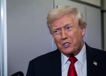 President Donald Trump speaks to reporters aboard Air Force One on its way to Florida on Nov. 25, 2025.