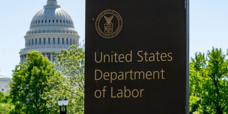 In this May 7, 2020, file photo, the entrance to the Labor Department is seen near the Capitol in Washington.