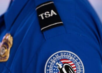 An employee of the Transportation Security Administration stands at Orlando International Airport in Orlando, Florida, on Nov. 9, 2025.