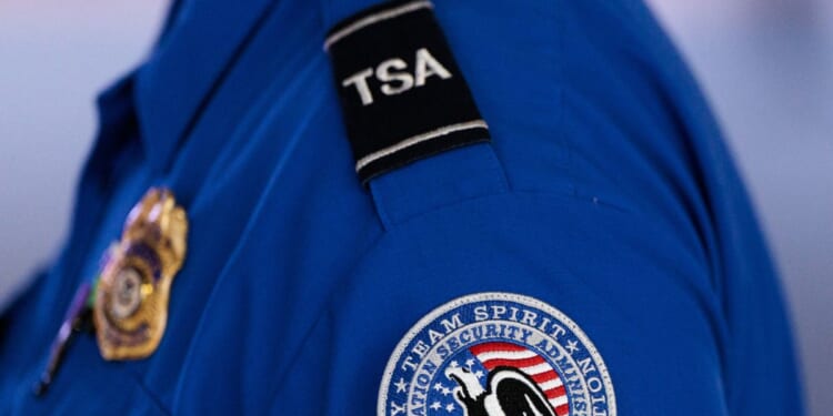 An employee of the Transportation Security Administration stands at Orlando International Airport in Orlando, Florida, on Nov. 9, 2025.