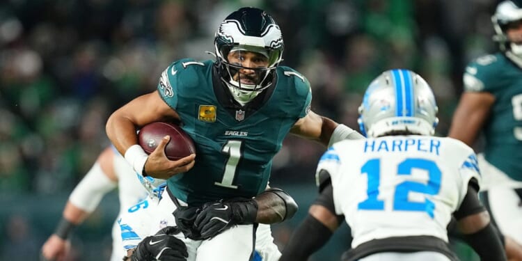 Jalen Hurts of the Philadelphia Eagles is brought down by Al-Quadin Muhammad of the Detroit Lions during the first half at Lincoln Financial Field on Nov. 16, 2025, in Philadelphia, Pennsylvania.