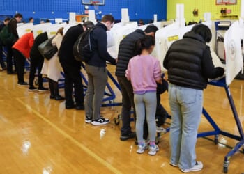 People vote at a polling location at the High School of Art and Design in the Manhattan borough of New York City on Tuesday.