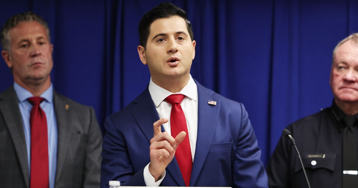 Acting U.S. Attorney Bill Essayli speaks as Los Angeles Police Department Chief Jim McDonnell and Special Agent in Charge Kenny Cooper of the Bureau of Alcohol, Tobacco, Firearms and Explosives, Los Angeles Field Division, look on at a press conference announcing an arrest in the Palisades Fire investigation on Oct. 8, 2025, in Los Angeles, California.