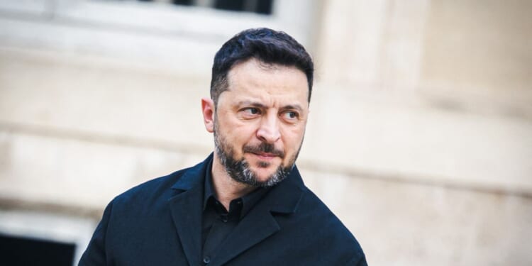 Ukrainian President Volodymyr Zelensky walks across the courtyard before his meeting with French President Emmanuel Macron at the Presidential Palace in Paris, France, on Nov. 17, 2025.