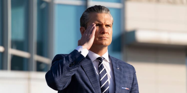 US Secretary of Defense Pete Hegseth salutes as he inspects a guard of honor in Seoul, South Korea on Nov. 4, 2025.