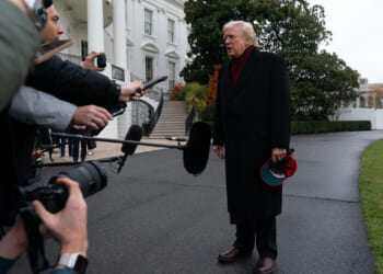 President Donald Trump talks to reporters as he departs from the South Lawn of the White House on Nov. 22, 2025, in Washington, D.C., en route to Joint Base Andrews.