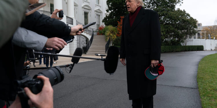 President Donald Trump talks to reporters as he departs from the South Lawn of the White House on Nov. 22, 2025, in Washington, D.C., en route to Joint Base Andrews.