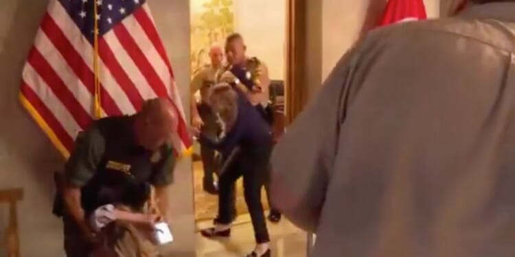 Democratic Tennessee candidate Aftyn Behn is dragged out of Gov. Lee's office as she sobs after she charged into it uninvited.