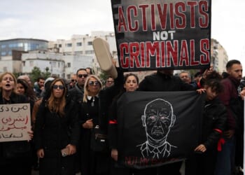 Tunisian police detain human rights defender as sweep against critics widens