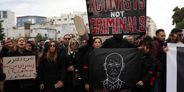 Tunisian police detain human rights defender as sweep against critics widens
