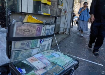 Iran's rial falls to a new low as nuclear sanctions squeeze its ailing economy