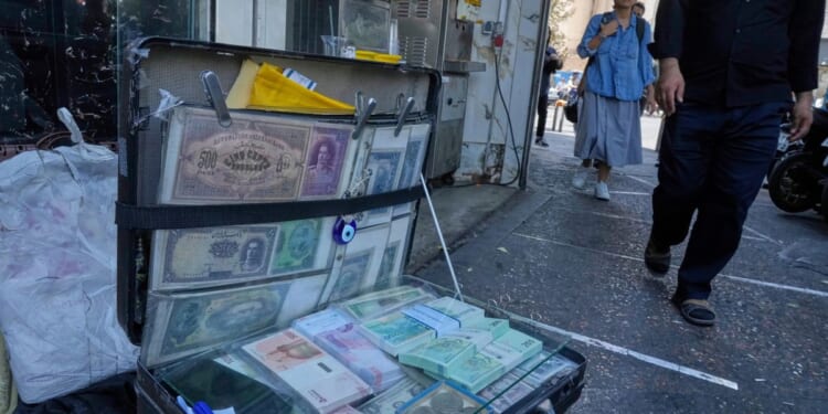 Iran's rial falls to a new low as nuclear sanctions squeeze its ailing economy